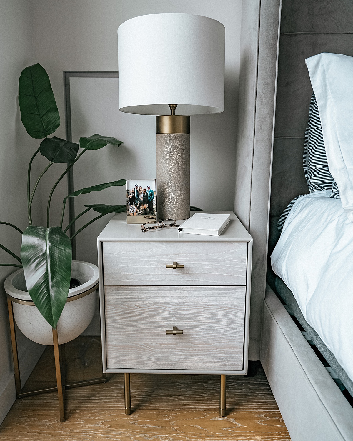 west elm night stand, shagreen lamp, bedroom plant, fake plant, shagreen lamp, nyc apartment, home decor tips, affordable home decor, olivia rink bedroom, olivia rink apartment, olivia rink bedroom, affordable decorating, new york life, new york apartment, nyc living, west elm, kathy kuo home, home decor, bedroom decor, frame, bedside frame, gold frame